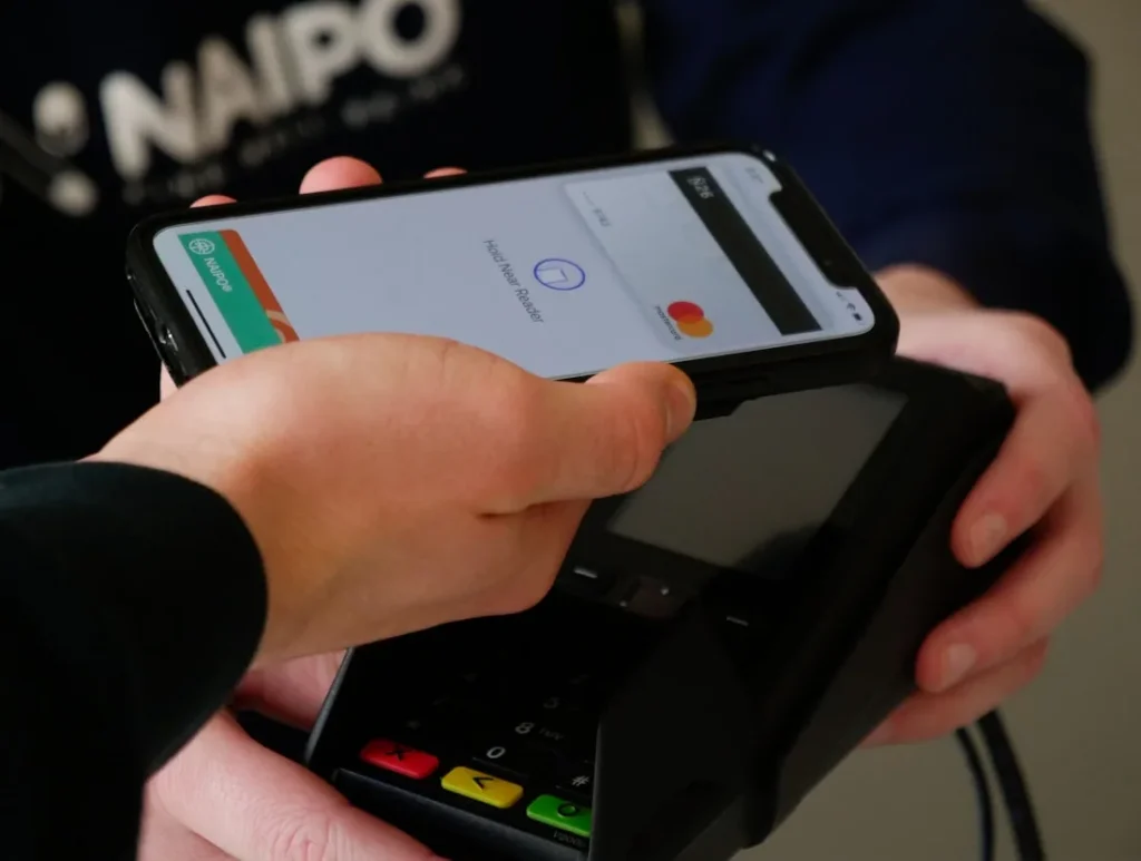 Phone and payment terminal illustrating phishing risk for banks