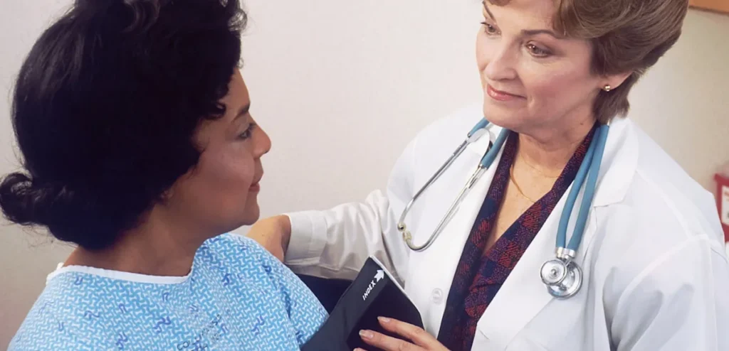 Healthcare worker with a patient in a hospital
